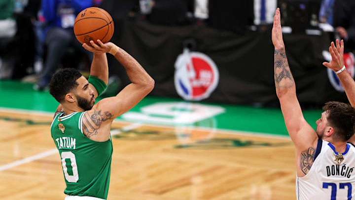 Jun 17, 2024; Boston, Massachusetts, USA; Boston Celtics forward Jayson Tatum (0) shoots the ball against Dallas Mavericks guard Luka Doncic (77) in game five of the 2024 NBA Finals at TD Garden. Mandatory Credit: Peter Casey-Imagn Images Jun 17, 2024; Boston, Massachusetts, USA; Boston Celtics forward Jayson Tatum (0) shoots the ball against Dallas Mavericks guard Luka Doncic (77) in game five of the 2024 NBA Finals at TD Garden. Mandatory Credit: Peter Casey-Imagn Images