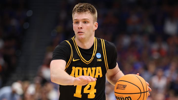 Mar 22, 2026; Tampa, FL, USA; Iowa Hawkeyes guard Bennett Stirtz (14) dribbles the ball against the Florida Gators in the second half during a second round game of the men's 2026 NCAA Tournament at Benchmark International Arena. Mandatory Credit: Nathan Ray Seebeck-Imagn Images