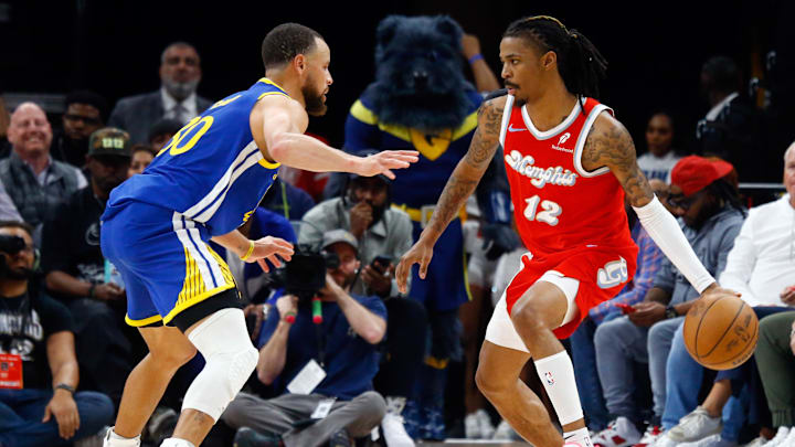Apr 1, 2025; Memphis, Tennessee, USA; Memphis Grizzlies guard Ja Morant (12) dribbles as Golden State Warriors guard Stephen Curry (30) defends during the fourth quarter at FedExForum. Mandatory Credit: Petre Thomas-Imagn Images Apr 1, 2025; Memphis, Tennessee, USA; Memphis Grizzlies guard Ja Morant (12) dribbles as Golden State Warriors guard Stephen Curry (30) defends during the fourth quarter at FedExForum. Mandatory Credit: Petre Thomas-Imagn Images