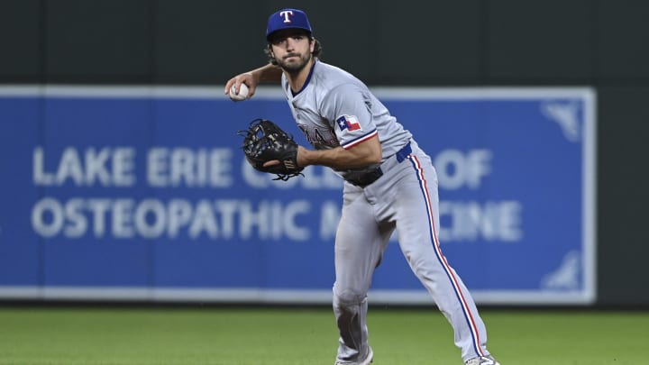 Jun 29, 2024; Baltimore, Maryland, USA;  Texas Rangers third baseman Josh Smith (8) throws to first base during the eighth inning 
against the Baltimore Orioles at Oriole Park at Camden Yards. Mandatory Credit: Tommy Gilligan-USA TODAY Sports