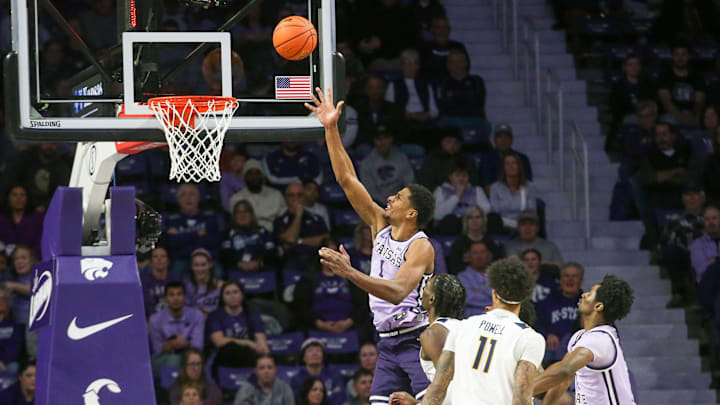 Jan 25, 2025; Manhattan, Kansas, USA; Kansas State Wildcats forward David N'Guessan (1) makes a layup against the West Virginia Mountaineers during the second half at Bramlage Coliseum. Mandatory Credit: Scott Sewell-Imagn Images