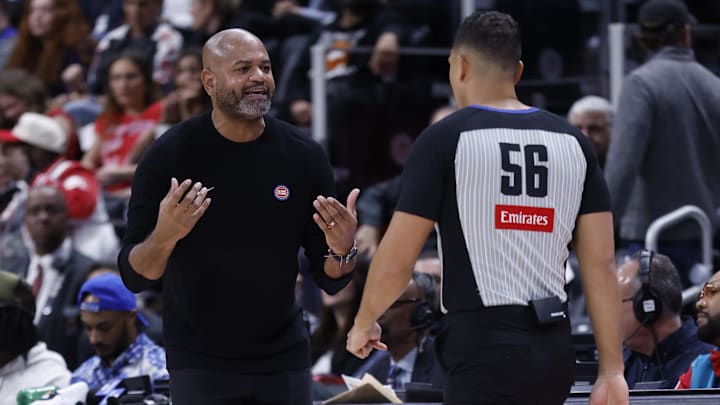 Mar 28, 2025; Detroit, Michigan, USA;  Detroit Pistons head coach J.B. Bickerstaff talks to referee John Conleyin the first half against the Cleveland Cavaliers at Little Caesars Arena. Mandatory Credit: Rick Osentoski-Imagn Images