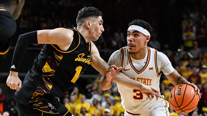 Mar 7, 2026; Ames, Iowa, USA; Iowa State Cyclones guard Tamin Lipsey (3) goes to the basket as Arizona State Sun Devils forward Andrija Grbovic (14) defends during the first half at James H. Hilton Coliseum. Mandatory Credit: Jeffrey Becker-Imagn Images
