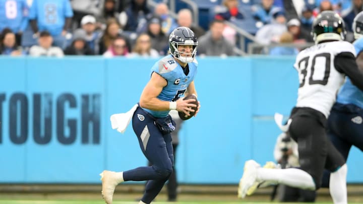 Dec 8, 2024; Nashville, Tennessee, USA;   Tennessee Titans Will Levis (8) gets flushed from the pocket against the Jacksonville Jaguars during the second half at Nissan Stadium. Mandatory Credit: Steve Roberts-Imagn Images