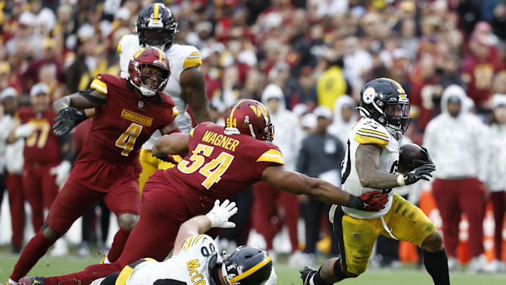 Pittsburgh Steelers running back Jaylen Warren carries the ball past Washington Commanders linebacker Bobby Wagner. Pittsburgh Steelers running back Jaylen Warren carries the ball past Washington Commanders linebacker Bobby Wagner.