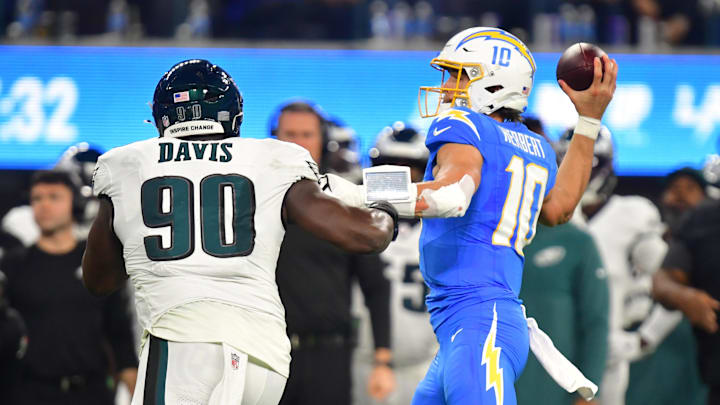 Dec 8, 2025; Inglewood, California, USA; Los Angeles Chargers quarterback Justin Herbert (10) throws against Philadelphia Eagles defensive tackle Jordan Davis (90) in the second half at SoFi Stadium. Dec 8, 2025; Inglewood, California, USA; Los Angeles Chargers quarterback Justin Herbert (10) throws against Philadelphia Eagles defensive tackle Jordan Davis (90) in the second half at SoFi Stadium.