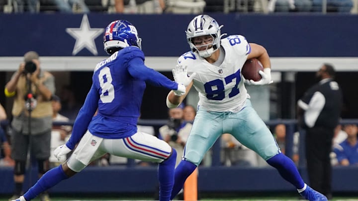 Dallas Cowboys tight end Jake Ferguson runs with the ball against New York Giants safety Jevon Holland