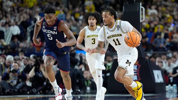 Michigan guard Roddy Gayle Jr. (11) moves the ball down the court during the second half of the NCAA national championship game at Lucas Oil Stadium in Indianapolis on Monday, April 6, 2026. Michigan guard Roddy Gayle Jr. (11) moves the ball down the court during the second half of the NCAA national championship game at Lucas Oil Stadium in Indianapolis on Monday, April 6, 2026.