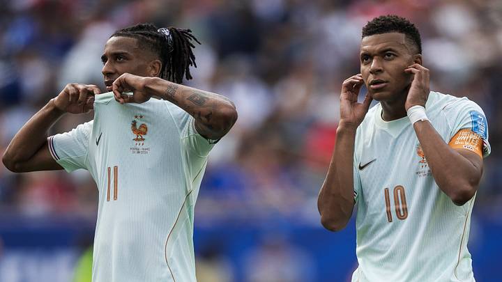 Kylian Mbappe (R) and Michael Olise of France react during Kylian Mbappe (R) and Michael Olise of France react during