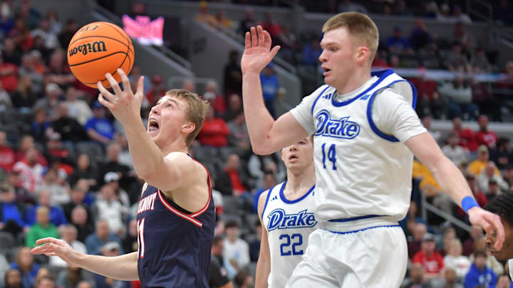 Mar 8, 2025; St. Louis, MO, Belmont Bruins forward Drew Scharnowski (11) catches the ball in front of Drake Bulldogs guard Bennett Stirtz (14) during the first half at Enterprise Center. 