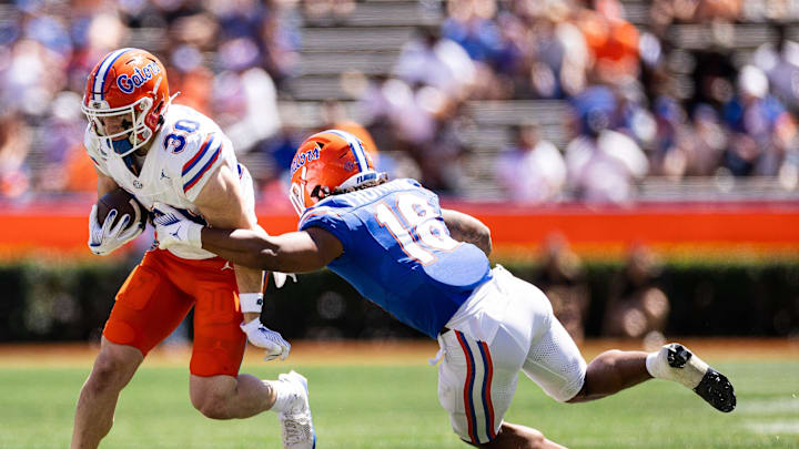 Florida Gators wide receiver Taylor Spierto (30) runs with the ball after a catch.