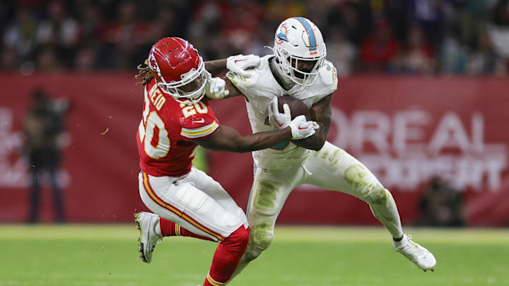 Miami Dolphins running back Raheem Mostert (31) holds off Kansas City Chiefs safety Justin Reid (20) in the fourth quarter during an NFL International Series game at Deutsche Bank Park in the 2023 season. Miami Dolphins running back Raheem Mostert (31) holds off Kansas City Chiefs safety Justin Reid (20) in the fourth quarter during an NFL International Series game at Deutsche Bank Park in the 2023 season.
