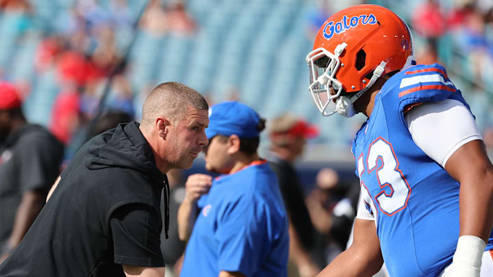Oct 28, 2023; Jacksonville, Florida, USA; Florida Gators head coach Billy Napier and offensive lineman Bryce Lovett (53) prior to the game at EverBank Stadium. Mandatory Credit: Kim Klement Neitzel-Imagn Images