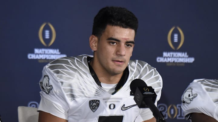 Jan 12, 2015; Arlington, TX, USA; Oregon Ducks quarterback Marcus Mariota speaks at a press conference after the 2015 CFP National Championship Game against the Ohio State Buckeyes at AT&T Stadium. Ohio State won 42-20. Mandatory Credit: Kirby Lee-Imagn Images