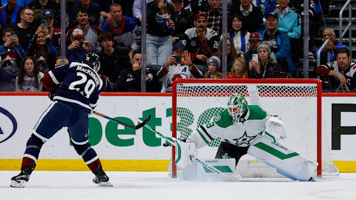 Mar 18, 2026; Denver, Colorado, USA; Colorado Avalanche center Nathan MacKinnon (29) shoots the puck wide of the net against Dallas Stars goaltender Jake Oettinger (29) in the shootout at Ball Arena. Mandatory Credit: Isaiah J. Downing-Imagn Images