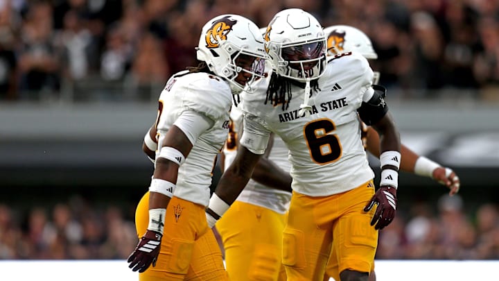Sep 6, 2025; Starkville, Mississippi, USA; Arizona State Sun Devils defensive back Xavion Alford (2) reacts with defensive back Adrian Wilson (6) during the first quarter against the Mississippi State Bulldogs at Davis Wade Stadium at Scott Field. Mandatory Credit: Petre Thomas-Imagn Images