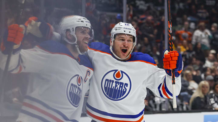 Apr 26, 2024; Los Angeles, California, USA; Edmonton Oilers left wing Zach Hyman (18), right, celebrates with Edmonton Oilers Connor McDavid (97), left, after McDavid scored a goal against the Los Angeles Kings in the first period of game three of the first round of the 2024 Stanley Cup Playoffs at Crypto.com Arena. Mandatory Credit: Yannick Peterhans-USA TODAY Sports