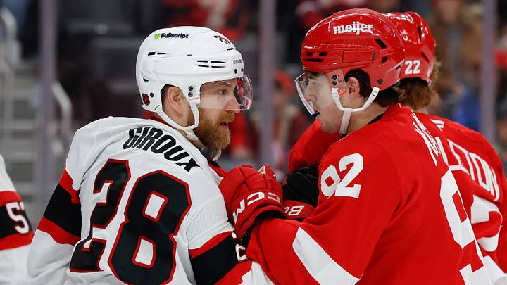 Jan 18, 2026; Detroit, Michigan, USA;  Ottawa Senators right wing Claude Giroux (28) and Detroit Red Wings center Mason Appleton (22) grab each other in the first period at Little Caesars Arena. Mandatory Credit: Rick Osentoski-Imagn Images