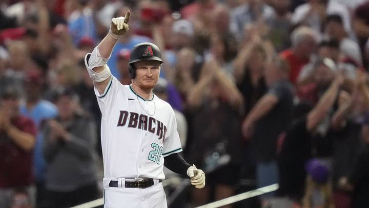 Arizona Diamondbacks designated hitter Pavin Smith (26) celebrates after hitting a single during the ninth inning against the Philadelphia Phillies in Game 3 of the NLCS of the 2023 MLB playoffs at Chase Field in Phoenix on Oct. 19, 2023.