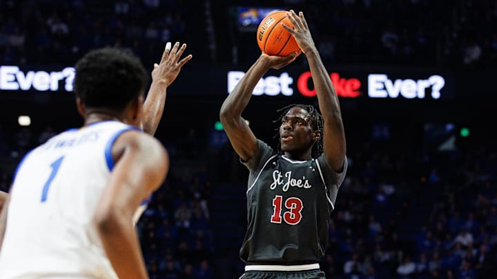 Nov 20, 2023; Lexington, Kentucky, USA; Saint Joseph's Hawks forward Rasheer Fleming (13) shoots the ball during the first half against the Kentucky Wildcats at Rupp Arena at Central Bank Center. Mandatory Credit: Jordan Prather-Imagn Images Nov 20, 2023; Lexington, Kentucky, USA; Saint Joseph's Hawks forward Rasheer Fleming (13) shoots the ball during the first half against the Kentucky Wildcats at Rupp Arena at Central Bank Center. Mandatory Credit: Jordan Prather-Imagn Images
