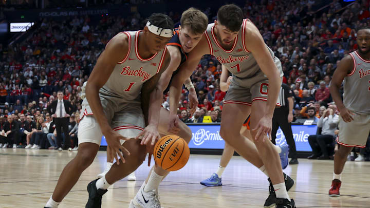 Feb 14, 2026; Nashville, Tennessee, USA; Ohio State Buckeyes forward Amare Bynum (1) and center Ivan Njegovan (7) steal the ball from Virginia Cavaliers center Johann Gruenloh (17) during the second half at Bridgestone Arena. Mandatory Credit: Steve Roberts-Imagn Images Feb 14, 2026; Nashville, Tennessee, USA; Ohio State Buckeyes forward Amare Bynum (1) and center Ivan Njegovan (7) steal the ball from Virginia Cavaliers center Johann Gruenloh (17) during the second half at Bridgestone Arena. Mandatory Credit: Steve Roberts-Imagn Images