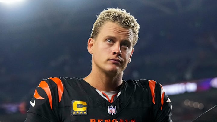 Cincinnati Bengals quarterback Joe Burrow (9) and head coach Zac Taylor head for the locker room after the fourth quarter of the NFL Week 3 game between the Cincinnati Bengals and the Washington Commanders at Paycor Stadium in downtown Cincinnati on Monday, Sept. 23, 2024. The Bengals remain winless after a 38-33 loss to Washington.