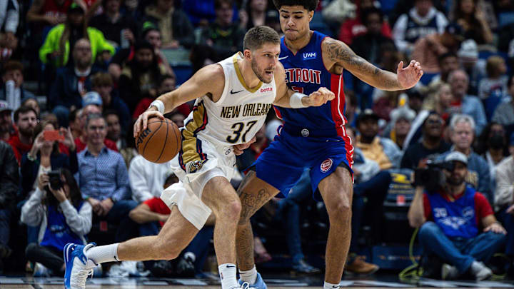 Nov 2, 2023; New Orleans, Louisiana, USA;  New Orleans Pelicans forward Matt Ryan (37) dribbles against Detroit Pistons guard Killian Hayes (7): Stephen Lew-Imagn Images