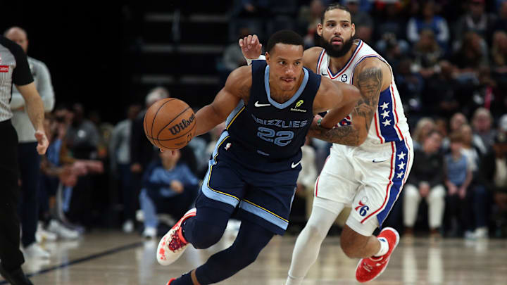 Nov 20, 2024; Memphis, Tennessee, USA; Memphis Grizzlies guard Desmond Bane (22) drives to the basket as Philadelphia 76ers forward Caleb Martin (16) defends during the second half at FedExForum. Mandatory Credit: Petre Thomas-Imagn Images Nov 20, 2024; Memphis, Tennessee, USA; Memphis Grizzlies guard Desmond Bane (22) drives to the basket as Philadelphia 76ers forward Caleb Martin (16) defends during the second half at FedExForum. Mandatory Credit: Petre Thomas-Imagn Images