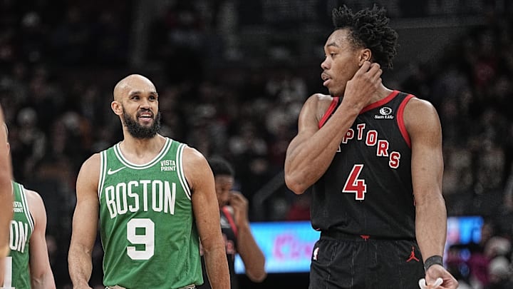 Jan 15, 2024; Toronto, Ontario, CAN; Boston Celtics guard Derrick White (9) talks with Toronto Raptors forward Scottie Barnes (4) during a break in the action during the second half at Scotiabank Arena. Mandatory Credit: John E. Sokolowski-Imagn Images