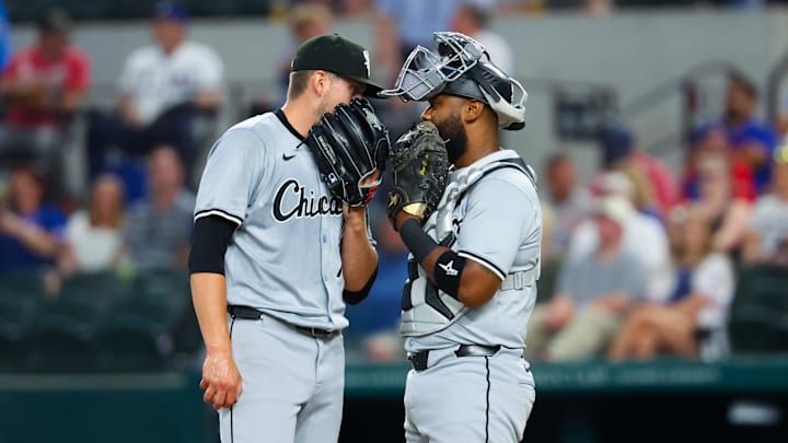 Chicago White Sox starting pitcher Chris Flexen (77) speaks with Chicago White Sox catcher Chuckie Robinson (47) during the first inning against the Texas Rangers at Globe Life Field on July 24, 2024.