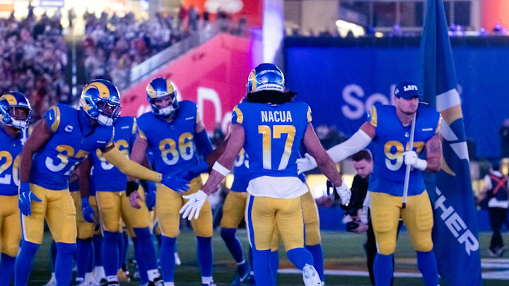 Jan 13, 2025; Glendale, AZ, USA; Los Angeles Rams wide receiver Puka Nacua (17) greets teammates prior to the game against the Minnesota Vikings in an NFC wild card game at State Farm Stadium. Mandatory Credit: Mark J. Rebilas-Imagn Images