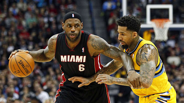 Dec 30, 2013; Denver, CO, USA; Miami Heat small forward LeBron James (6) still upset about not winning Defensive Player of the Year- Isaiah J. Downing/USA Today Sports