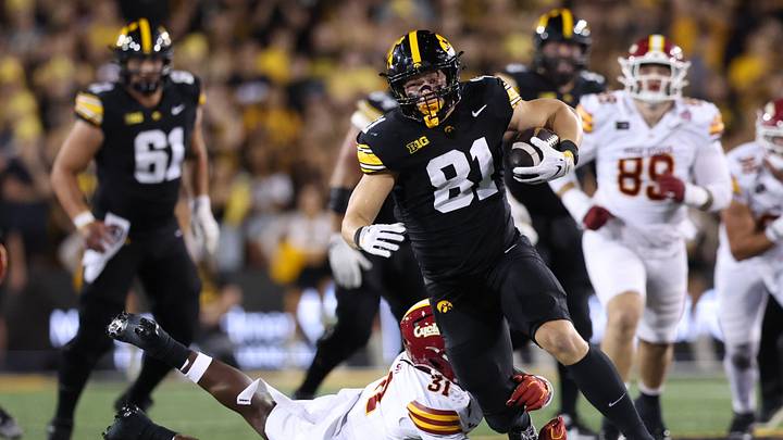 Sep 12, 2026; Iowa City, Iowa, USA;  Iowa Hawkeyes tight end DJ Vonnahme (81) runs after the catch as Iowa State Cyclones linebacker Montreze Smith Jr. (31) attempts to make the tackle during the fourth quarter at Kinnick Stadium.  Mandatory Credit: Reese Strickland-Imagn Images