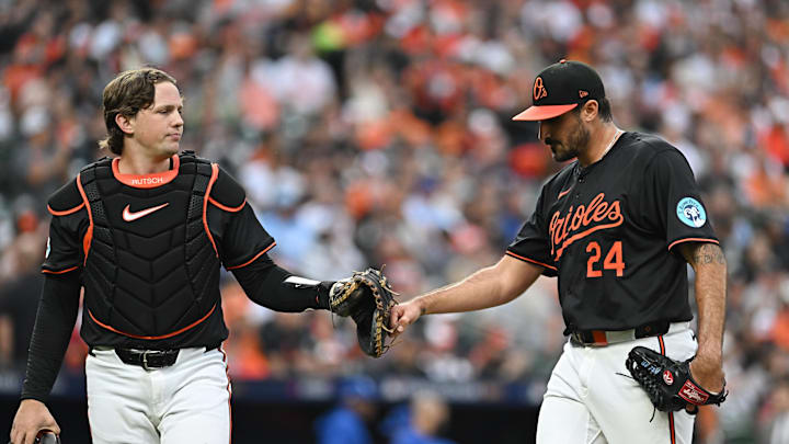 Oct 2, 2024; Baltimore, Maryland, USA; Baltimore Orioles pitcher Zach Eflin (24) and catcher Adley Rutschman (35) react after the 3rd inning against the Kansas City Royals in game two of the Wild Card round for the 2024 MLB Playoffs at Oriole Park at Camden Yards. Oct 2, 2024; Baltimore, Maryland, USA; Baltimore Orioles pitcher Zach Eflin (24) and catcher Adley Rutschman (35) react after the 3rd inning against the Kansas City Royals in game two of the Wild Card round for the 2024 MLB Playoffs at Oriole Park at Camden Yards.