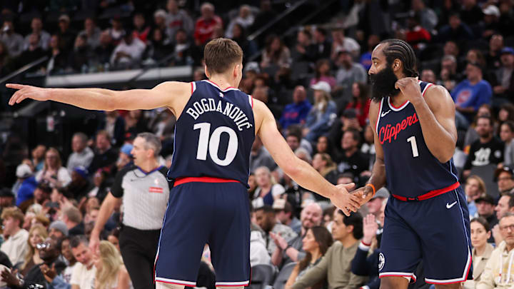 Bogdan Bogdanovic #10 and James Harden of the Los Angeles Clippers react against the Detroit Pistons.