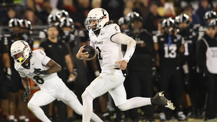 Nov 16, 2024; Ames, Iowa, USA; Cincinnati Bearcats quarterback Brendan Sorsby (2) runs the football against the Iowa State Cyclones in the first half at Jack Trice Stadium. Mandatory Credit: Reese Strickland-Imagn Images