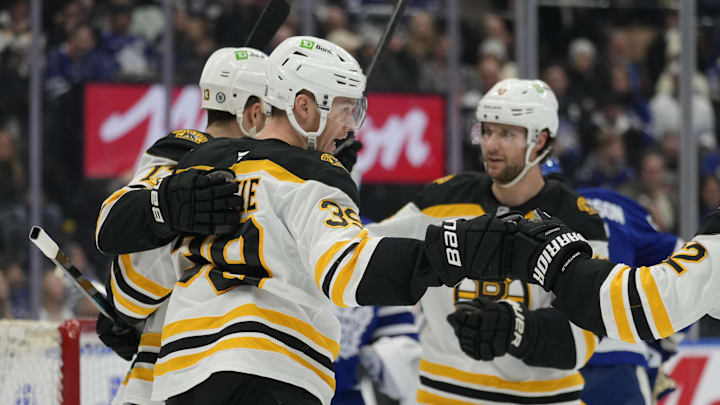 Jan 4, 2025; Toronto, Ontario, CAN; Boston Bruins forward Morgan Geekie (39) get congratulated after scoring against the Toronto Maple Leafs during the second period at Scotiabank Arena. Mandatory Credit: John E. Sokolowski-Imagn Images