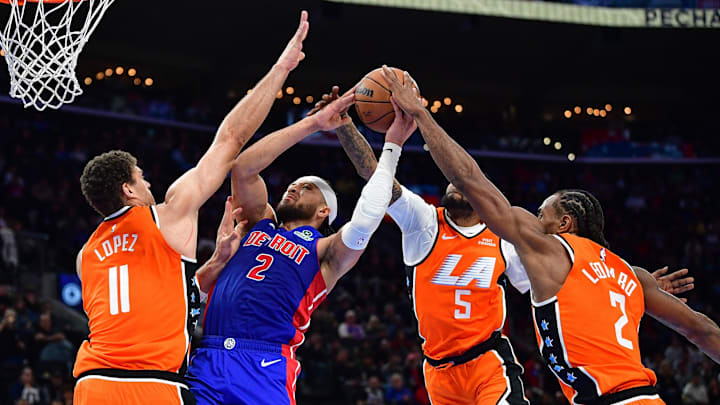 Dec 28, 2025; Inglewood, California, USA; Detroit Pistons guard Cade Cunningham (2) moves to the basket against Los Angeles Clippers center Brook Lopez (11) forward Derrick Jones Jr. (5) and forward Kawhi Leonard (2) during the second half at Intuit Dome. Mandatory Credit: Gary A. Vasquez-Imagn Images
