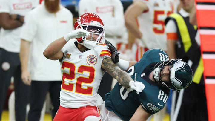 Feb 9, 2025; New Orleans, LA, USA; Kansas City Chiefs cornerback Trent McDuffie (22) and Philadelphia Eagles tight end Dallas Goedert (88) battle for position as they look for the ball in the first quarter in Super Bowl LIX at Ceasars Superdome. Mandatory Credit: Stephen Lew-Imagn Images