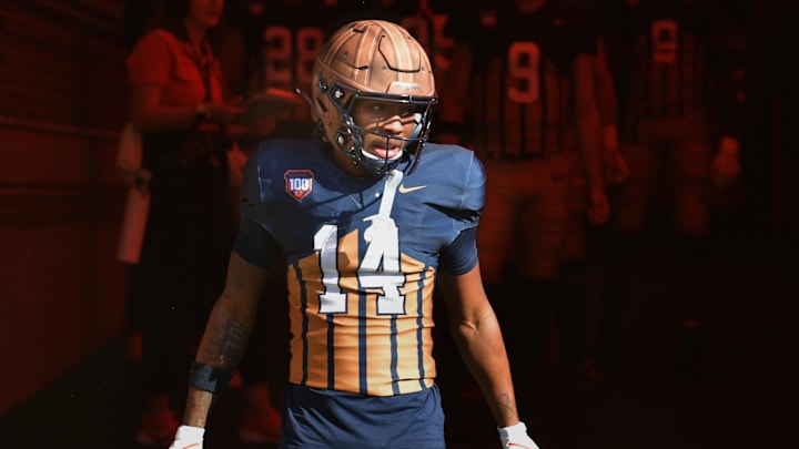Oct 19, 2024; Champaign, Illinois, USA; Illinois Fighting Illini defensive back Xavier Scott (14) steps into the light on the tunnel before the start of a game with the Michigan Wolverines at Memorial Stadium. Mandatory Credit: Ron Johnson-Imagn Images Oct 19, 2024; Champaign, Illinois, USA; Illinois Fighting Illini defensive back Xavier Scott (14) steps into the light on the tunnel before the start of a game with the Michigan Wolverines at Memorial Stadium. Mandatory Credit: Ron Johnson-Imagn Images