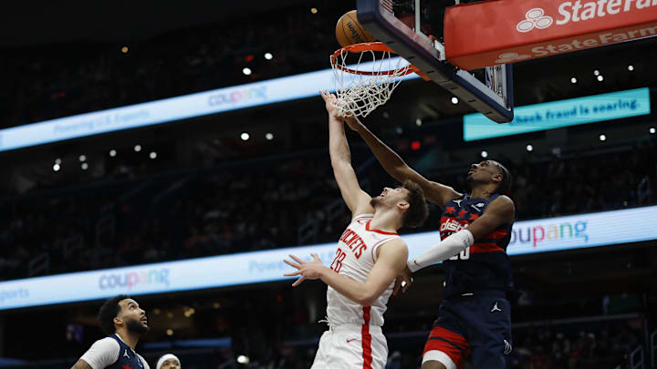 Jan 7, 2025; Washington, District of Columbia, USA; Houston Rockets center Alperen Sengun (28) shoots the ball as Washington Wizards forward Alexandre Sarr (20) defends in the fourth quarter at Capital One Arena. Mandatory Credit: Geoff Burke-Imagn Images Jan 7, 2025; Washington, District of Columbia, USA; Houston Rockets center Alperen Sengun (28) shoots the ball as Washington Wizards forward Alexandre Sarr (20) defends in the fourth quarter at Capital One Arena. Mandatory Credit: Geoff Burke-Imagn Images
