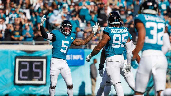 Dec 31, 2023; Jacksonville, Florida, USA; Jacksonville Jaguars safety Andre Cisco (5) celebrates a tackle against the Carolina Panthers during the first quarter at EverBank Stadium. Mandatory Credit: Morgan Tencza-USA TODAY Sports