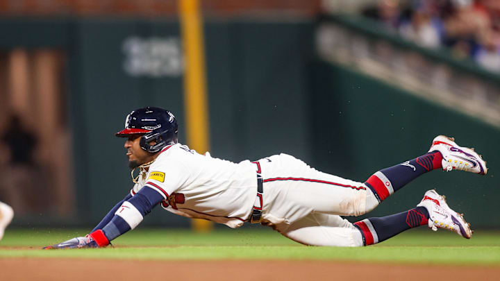 Mar 27, 2026; Atlanta, Georgia, USA; Atlanta Braves second baseman Ozzie Albies (1) slides into second base against the Kansas City Royals in the third inning at Truist Park. Mandatory Credit: Brett Davis-Imagn Images
