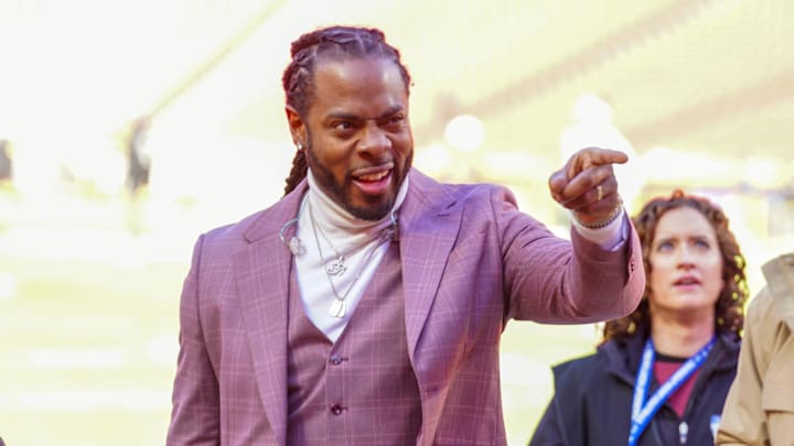 Nov 29, 2024; Kansas City, Missouri, USA; Commentator Richard Sherman signals to fans prior to a game between the Kansas City Chiefs and Las Vegas Raiders at GEHA Field at Arrowhead Stadium. Mandatory Credit: Denny Medley-Imagn Images