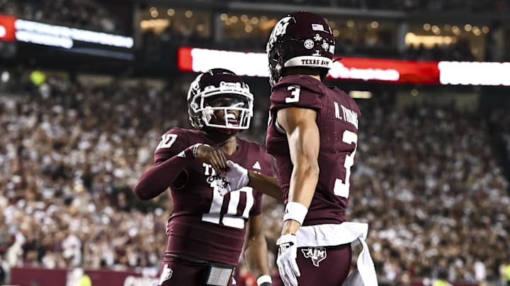 Nov 16, 2024; College Station, Texas, USA; Texas A&M Aggies defensive back Dezz Ricks (10) congratulates wide receiver Noah Thomas (3) after scoring a touchdown during the first quarter against the New Mexico State Aggies at Kyle Field. Mandatory Credit: Maria Lysaker-Imagn Images
