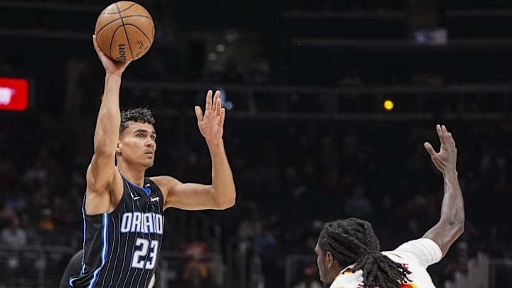 Orlando Magic forward Tristan da Silva (23) passes the ball over Atlanta Hawks guard Keaton Wallace (2) during the first half at State Farm Arena.