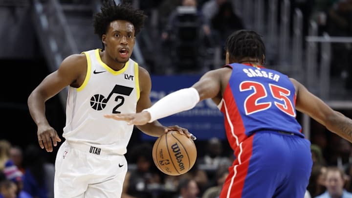 Dec 19, 2024; Detroit, Michigan, USA;  Utah Jazz guard Collin Sexton (2) dribbles on Detroit Pistons guard Marcus Sasser (25) in the third quarter at Little Caesars Arena. Mandatory Credit: Rick Osentoski-Imagn Images