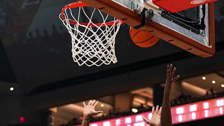 University of Connecticut guard Hassan Diarra (10) shoots over Texas Longhorns guard Tramon Mark (12) during the game at the Moody Center on Sunday, Dec. 8, 2024.