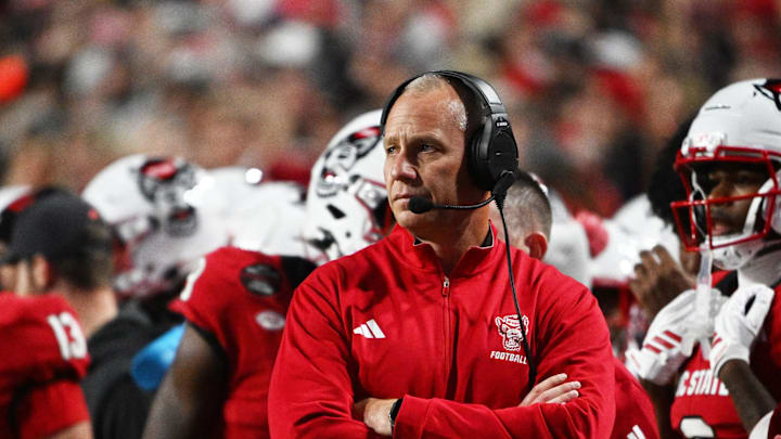 Nov 1, 2025; Raleigh, North Carolina, USA;  NC State Wolfpack head coach Dave Doeren during the first quarter at Carter-Finley Stadium. Mandatory Credit: Zachary Taft-Imagn Images