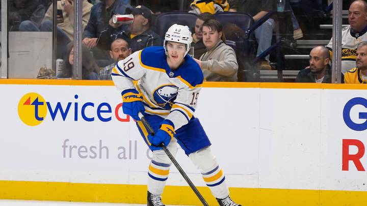 Feb 8, 2025; Nashville, Tennessee, USA;  Buffalo Sabres center Peyton Krebs (19) skates with the puck against the Nashville Predators during the first period at Bridgestone Arena. Mandatory Credit: Steve Roberts-Imagn Images